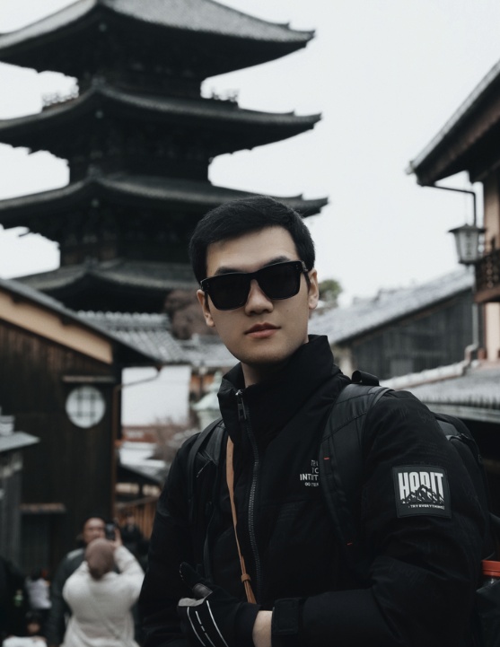 Hardy in Kyoto with a pagoda rising behind him