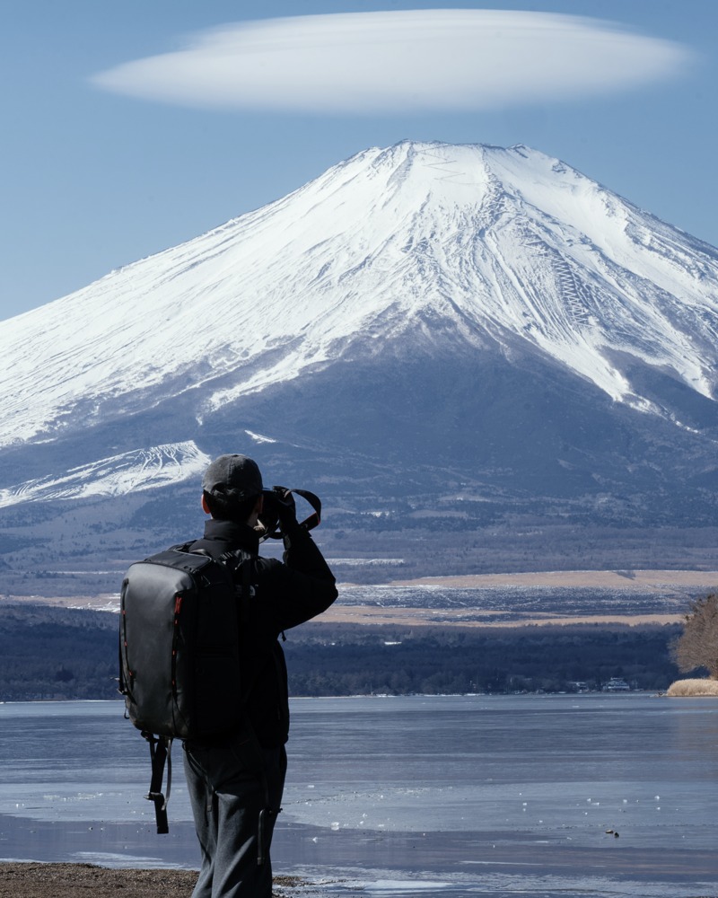 Hardy photographing Mount Fuji from a lakeshore