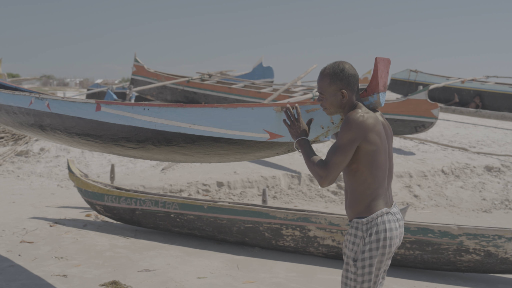 Coastal documentary frame before color grading