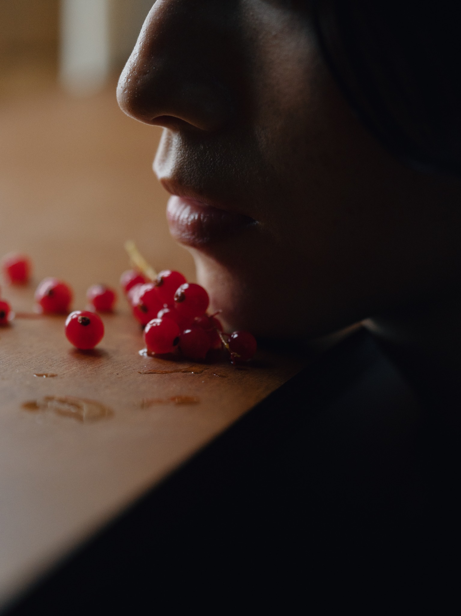 Conceptual portrait with red berries